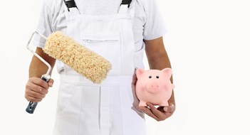 Budgeting For Design painter man with roller brush and piggy bank, isolated on white, saving concept