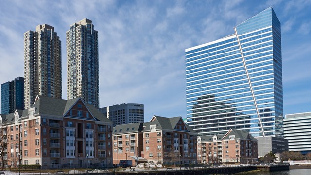 Jersey City, NJ USA - February 24 2021: A view of the Newport, Jersey City Waterfront area, showing the low-rise Avalon Cove apartments in the foreground, 480 Washington Blvd (2005) office tower on the right and the two 50 story Monaco apartment towers (2011) in the background.