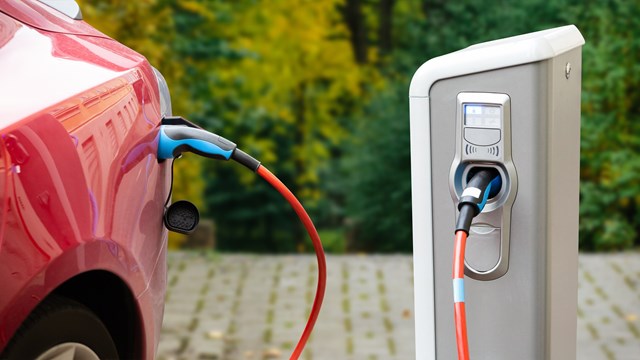 Close up of a charging electric car. Copy space