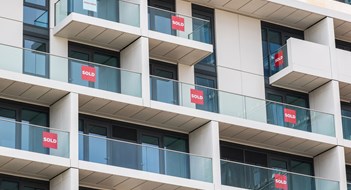 Brand new empty apartments with sold and available signs around Finsbury Park in London