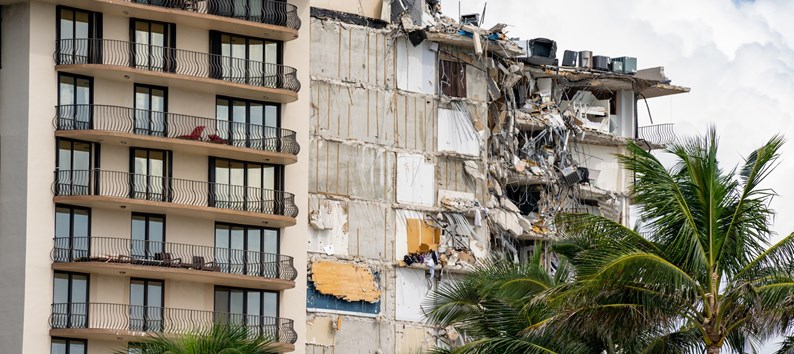 Miami Beach Surfside, FL, USA - June 26, 2021: Champlain Towers remains 2 days after collapse owners personal belongings visible hanging from the units