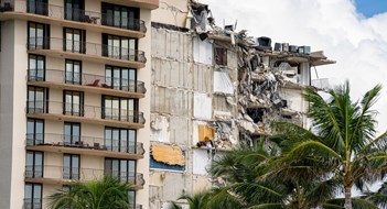 New Law Sets Reserve Requirements for NJ Communities: Miami Beach Surfside, FL, USA - June 26, 2021: Champlain Towers remains 2 days after collapse owners personal belongings visible hanging from the units