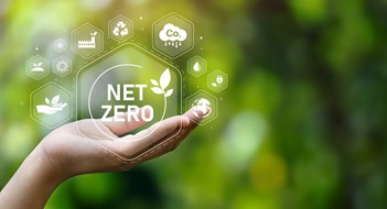 Climate Change vs. Multifamily Systems The concept of carbon neutral and net zero. natural environment A climate-neutral long-term strategy greenhouse gas emissions targets with green net center icon on hand cap and green background