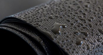 The Slush is Coming Water droplets on the rubber membrane. Waterproofing...  Close-up selective focus area.