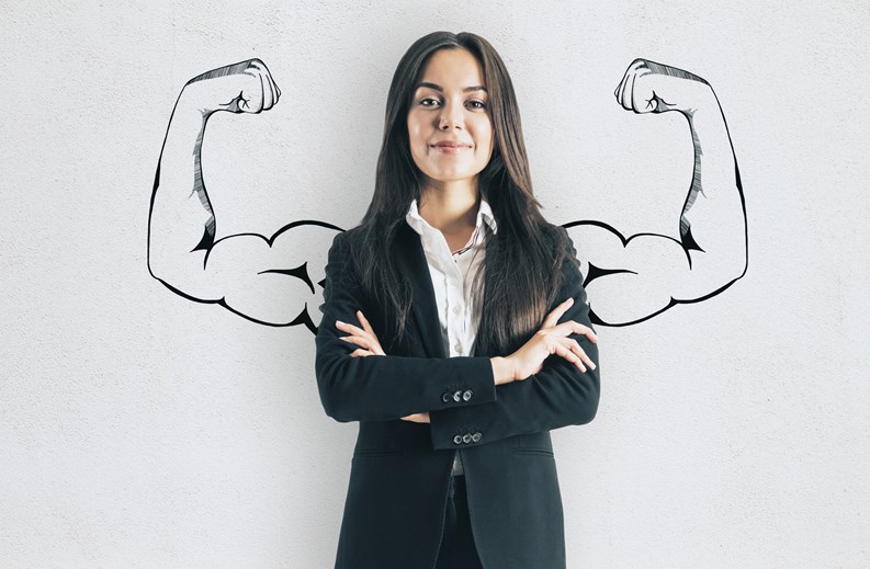 Portrait of attractive young european businesswoman with drawn muscly arms. Confidence and strength concept