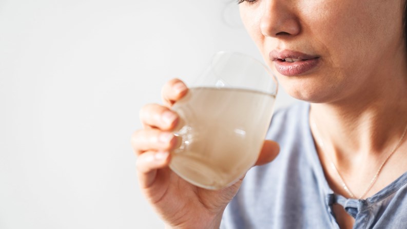 Looking at a glass of dirty water with suspicion