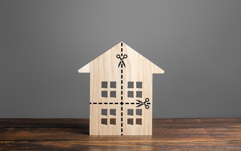 Residential building divided by a dotted line into four equal parts. Distribution of the right. Divorce concept. Disputes over division process of real estate and property after divorce.